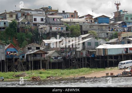 A favela area of Manaus taken from the river on the way out to see 'the meeting of the waters' trip. Stock Photo