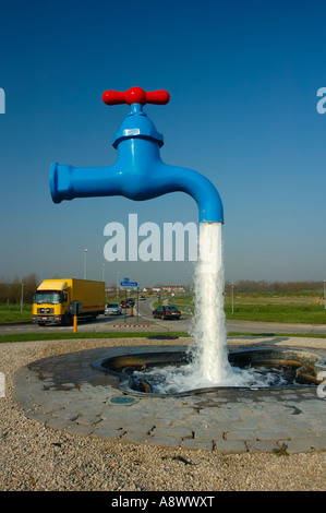 Illusion with a magic faucet and flowing water Stock Photo - Alamy
