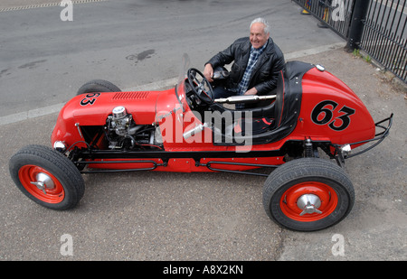 Restored red American dirt track race car with its owner Reg 1940’s Stock Photo