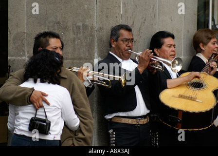 Mariachis playing on the street in downtown Mexico City Stock Photo