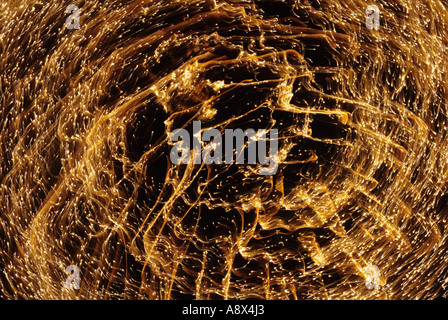 Detail of golden fireworks burst in night sky Stock Photo