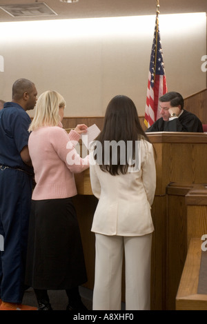 Defendant District Attorney and Parole officer talking to judge during proceedings Jackson County Circuit Court Missouri USA Stock Photo