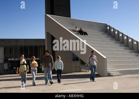 Students walking past large concrete steps "la scala" outside Aberystwyth Arts Centre on the campus of the University Wales UK Stock Photo