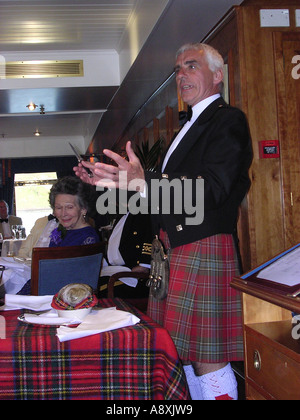 Addressing the haggis at a traditional Burns Night dinner on board the luxury cruise ship Hebridean Princess Stock Photo