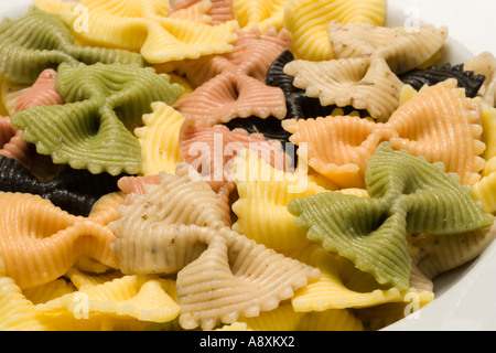cooked Italian 5 colour farfalle pasta coloured with spinach tomato beetroot oregano and ink cuttlefish Stock Photo