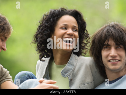 Group of friends, young woman laughing Stock Photo
