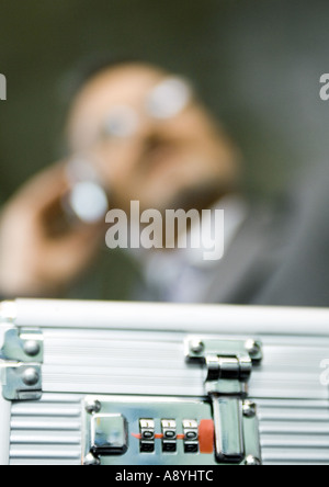 Combination lock on briefcase, extreme close-up Stock Photo