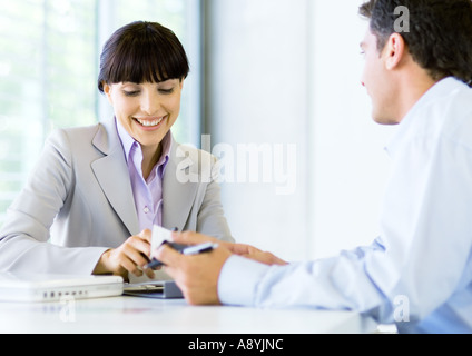 Man and woman having discussion in office Stock Photo