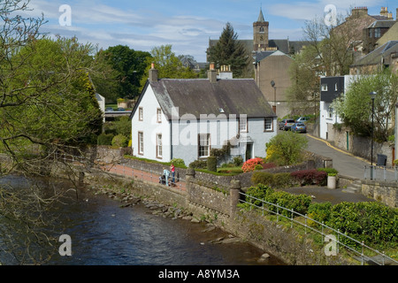 dh  DUNBLANE STIRLINGSHIRE People walking riverside white cottage by Allan Water scotland river home Stock Photo