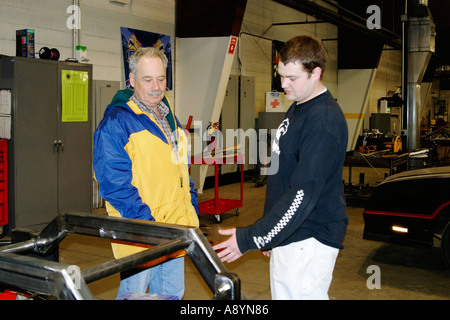 Two men in a work shop Stock Photo