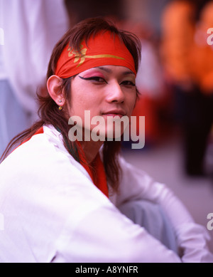 Handsome young Japanese man dressed in costume taking part in a yosakoi dance festival in Nagasaki Stock Photo