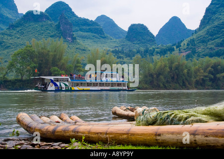 Bamboo Raft Tourist Passenger Cruise Passing through Limestone Karsts on the Li River in China Stock Photo