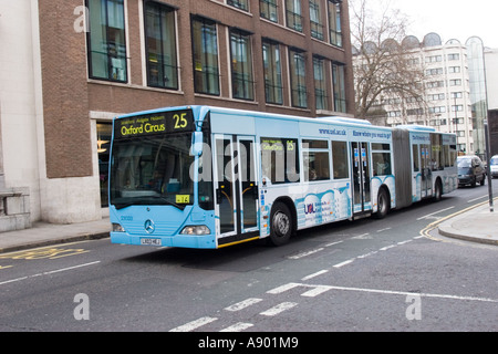 Blue London bendy bus in Cheapside, City of London, on route 25 to Oxford Circus Stock Photo