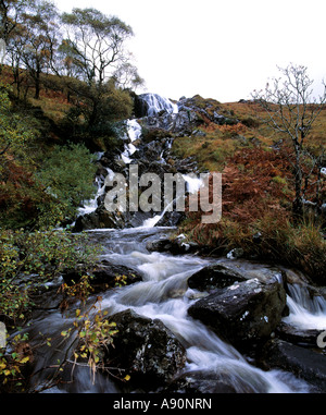 waterfall rolls over high cliffs on an irish mountain side Stock Photo