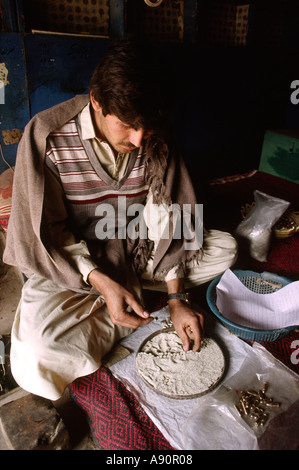 Pakistan NWFP Darra Adam Khel man making pistol bullets Stock Photo