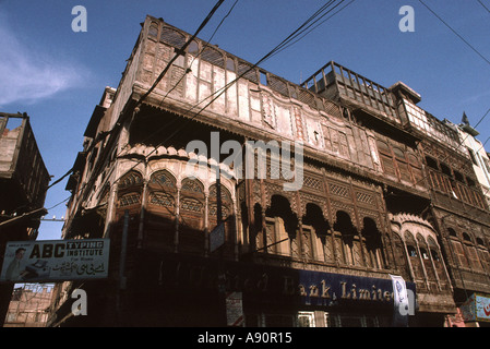 Pakistan NWFP Peshawar elaborately carved wooden balconies of building Stock Photo