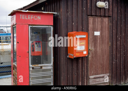 Telephone and post box on the dockside in Kirkenes Norway Stock Photo