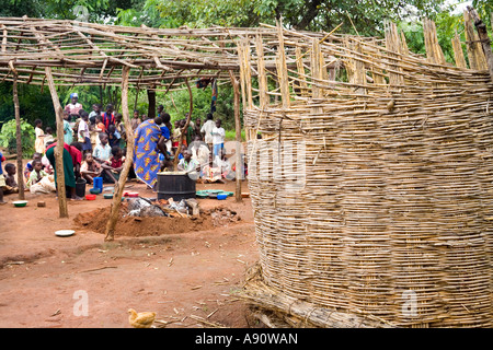 Children eating phala (maize porridge) as part of the Joseph Project feeding programme in the village of Kendekeza Malawi Africa Stock Photo