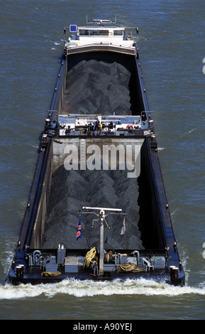 Pulverised coal loaded on a barge on the river Rhine in Cologne, North Rhine-Westphalia, Germany. Stock Photo