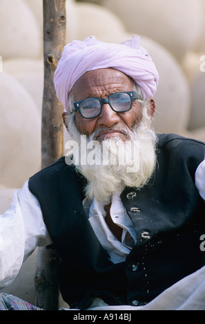 Muslim Man selling clay jars, Jaisalmer, Rajasthan, India Stock Photo