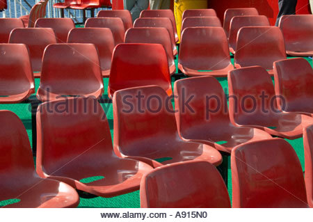 Rows of red plastic chairs Stock Photo