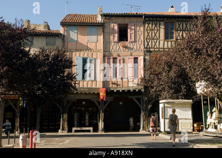 In the town Mirepoix central square  are half-timbered houses supported on wood pillars, creating an arcade Stock Photo