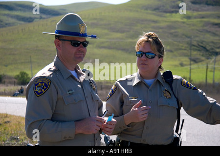 Male and female California highway patrol officers. Stock Photo