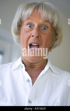 Senior Woman acting surprised Stock Photo