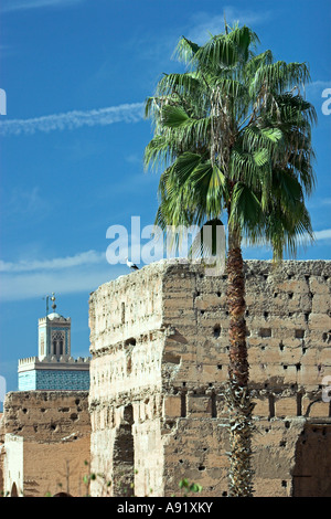 Minaret and jet aircraft contrails in Palais el Badi view Marrakech Morocco Stock Photo