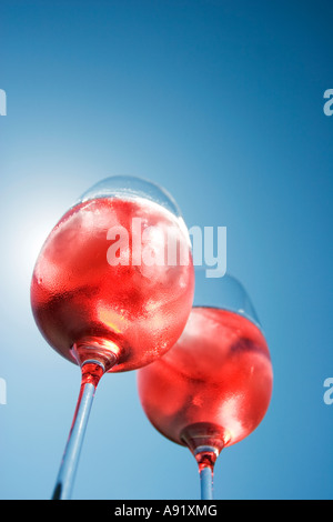 Sunlight shining through two glasses of rose wine Stock Photo
