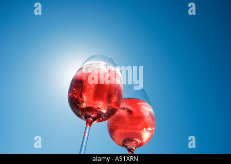 Sunlight shining through two glasses of rose wine Stock Photo