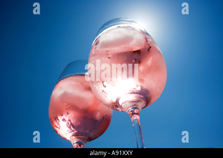 Sunlight shining through two glasses of rose wine Stock Photo