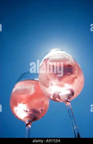 Sunlight shining through two glasses of rose wine Stock Photo