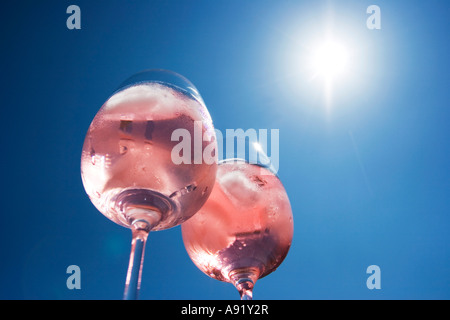 Sunlight shining through two glasses of rose wine Stock Photo