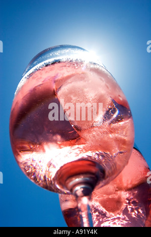 Sunlight shining through two glasses of rose wine Stock Photo