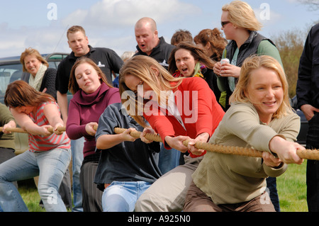 A female Tug 'O' War team at an annual country event between the villages of Ashley & Medbourne Leicestershire Northamptonshire Stock Photo