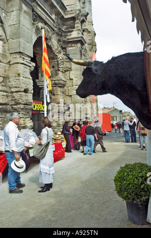 Arles France, Feria 'Bullfighting Festival' 'Street Scene' People Shopping in Arena Expo with 'Bull Head' Trophy Display Stock Photo