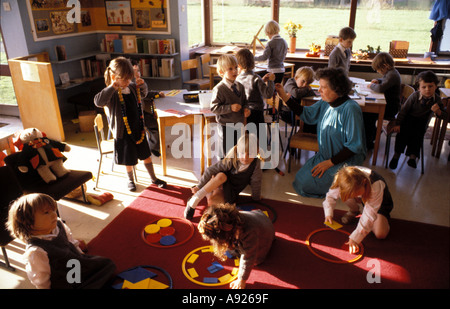 An active primary school multi tasking and learning through play activities Stock Photo
