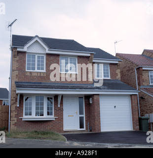 Newly Built house with integral garage on small estate Stock Photo