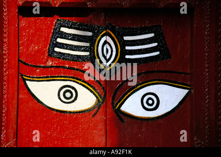 Red painted door with two eyes watching Durbar Square Kathmandu Nepal Stock Photo
