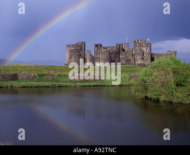 Caerphilly Castle View from west evening Rainbow in dark sky to side of castle Caerphilly South Wales UK Stock Photo