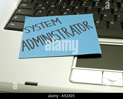 memo note on notebook system administrator Stock Photo
