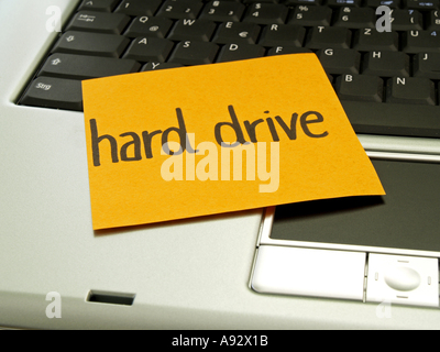 memo note on notebook, hard drive Stock Photo