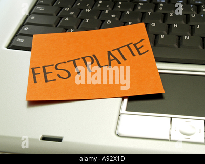 memo note on notebook, hard disk Stock Photo