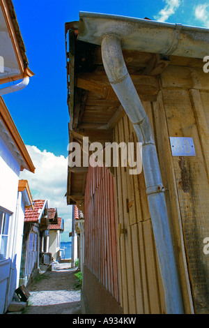 France Bassin d Arcachon Cap Ferret alley leading to the sea between wooden fishing huts. JMH0015 Stock Photo