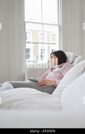 Woman sleeping on sofa Stock Photo