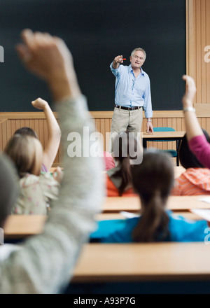 Professor picking out student for answer Stock Photo
