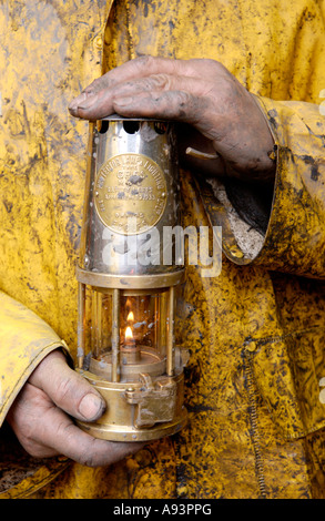 Coal miner with lamp at the newly re opened Unity Mine Cwmgwrach near Neath Wales UK GB EU Stock Photo