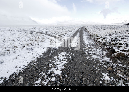 Snow-Covered Gravel Road, Perito Moreno National Park, Southern Andean Patagonia, Santa Cruz, Argentina Stock Photo