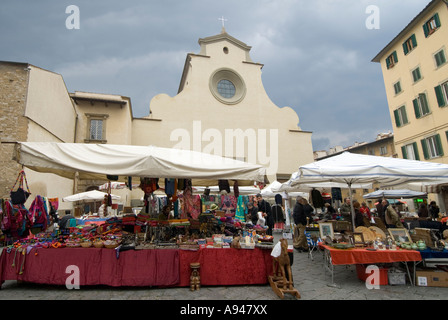 Horizontal wide angle of stalls at the Sunday market in Piazza di Santo Spirito on a stormy day. Stock Photo